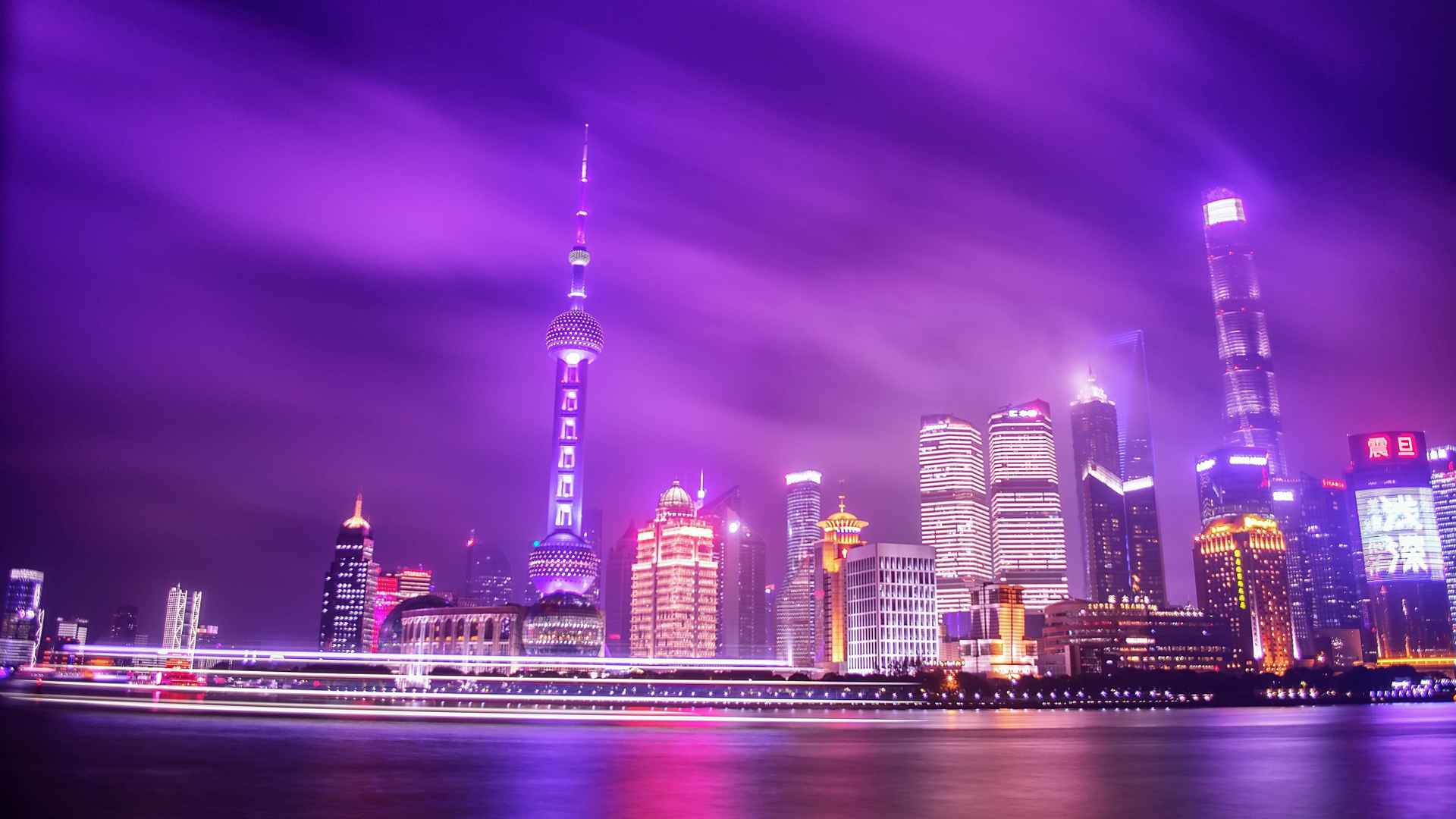 城市上空的紫色灯光唯美城市壁纸-