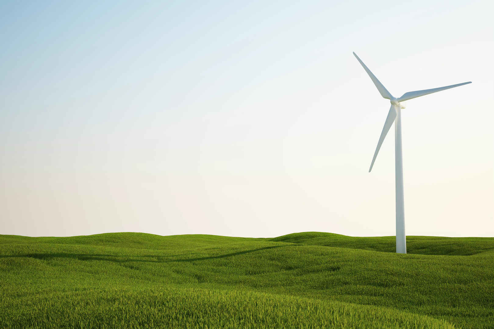 绿草地上新能源风力发电机图片-