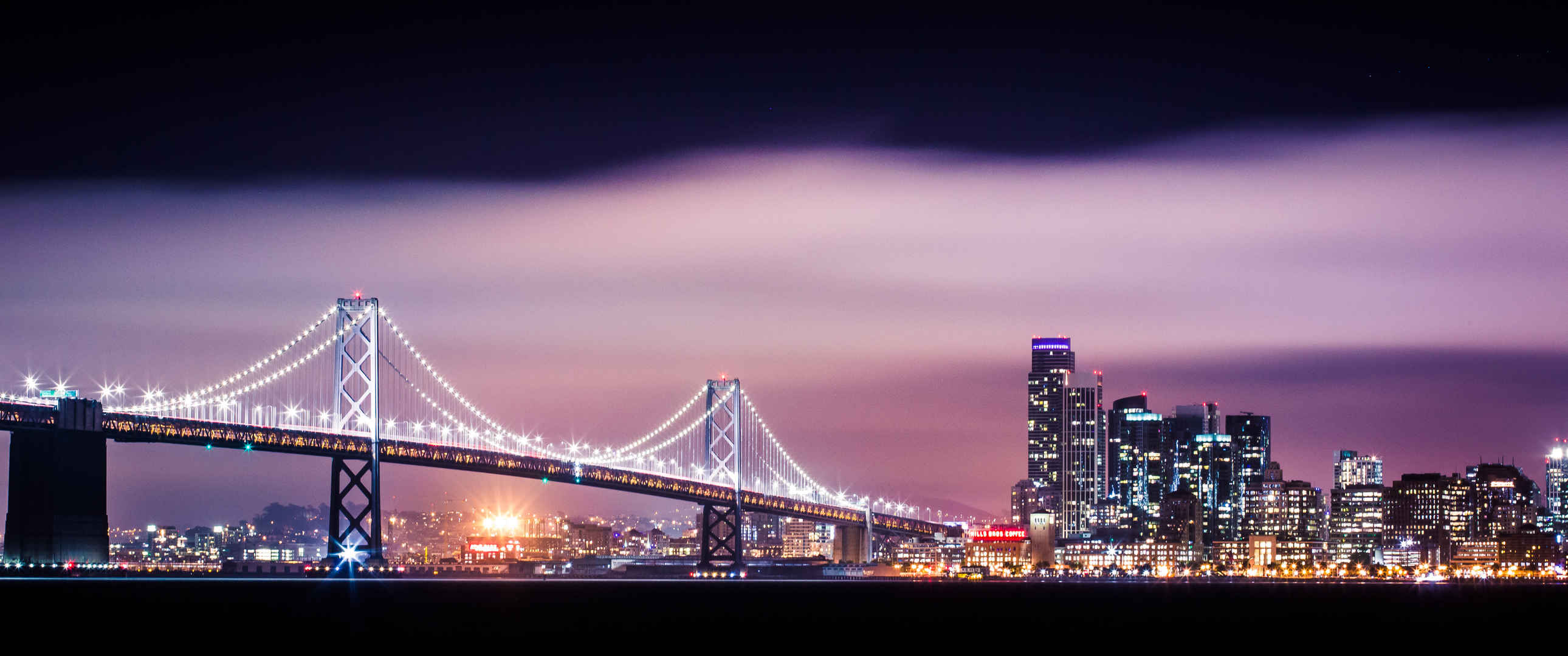 海湾大桥与旧金山摩天大楼城市夜景3440x1440壁纸-