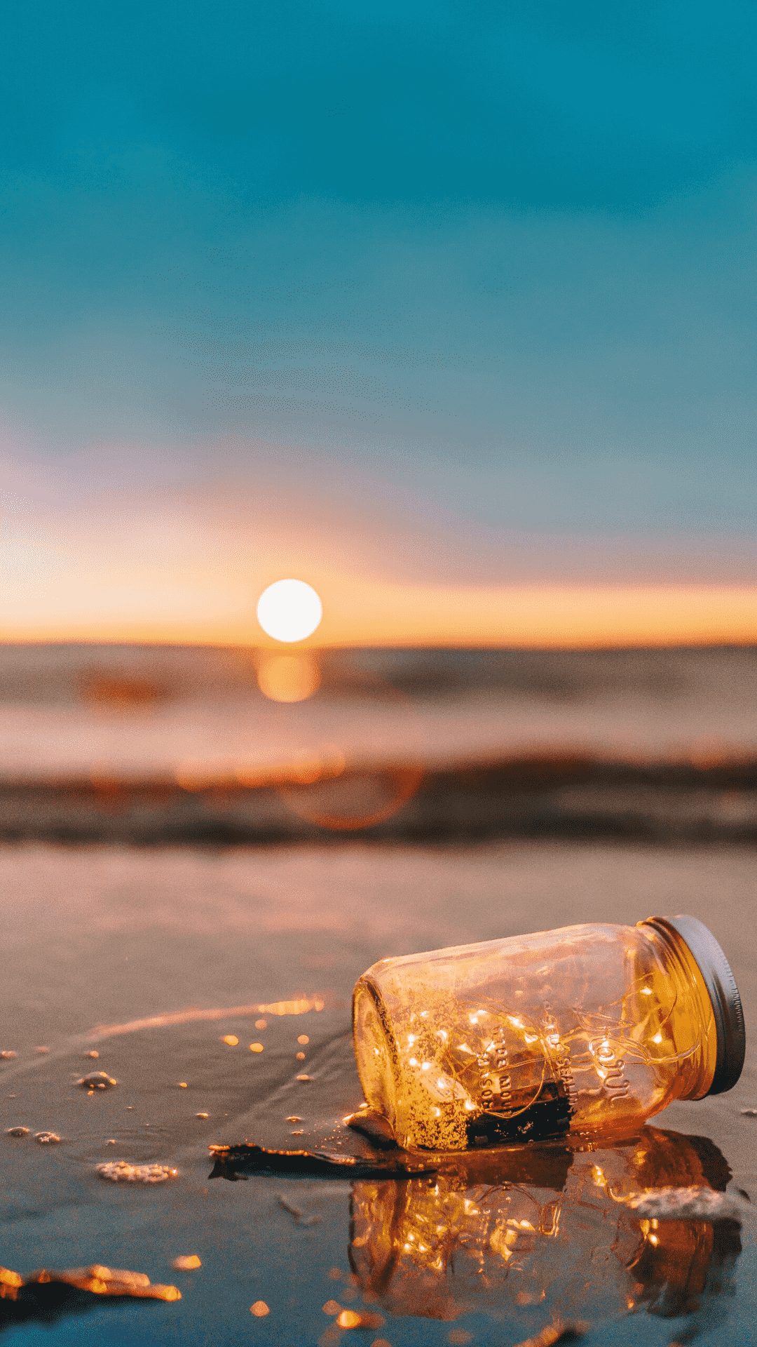 日落 沙滩 玻璃瓶手机壁纸