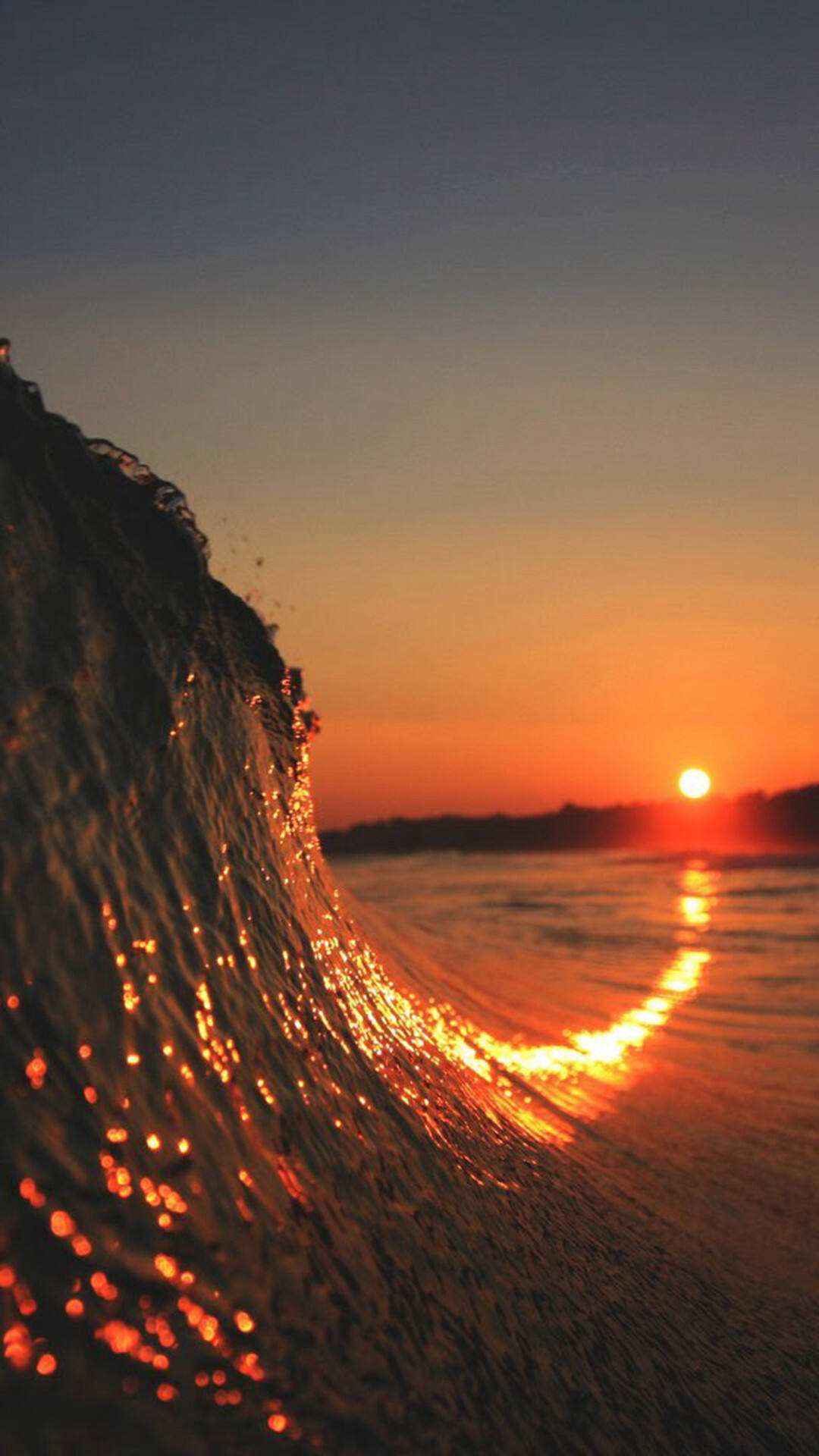 热爱旅游的朋友必选！海浪加夕阳的唯美景象手机壁纸