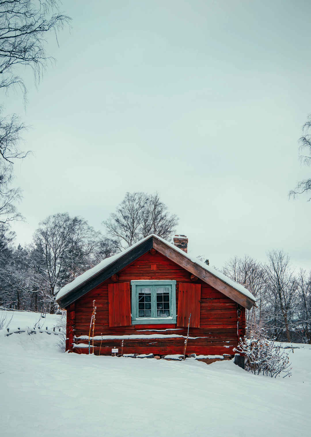 冬天雪地红色木房子手机壁纸图片
